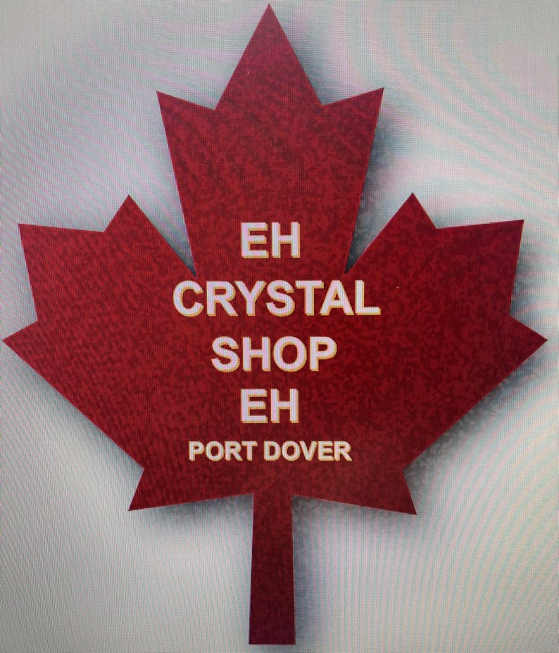 May include: A red maple leaf with the text "EH CRYSTAL SHOP EH PORT DOVER" in white.