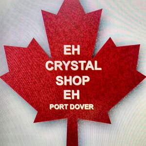 May include: A red maple leaf with the text "EH CRYSTAL SHOP EH PORT DOVER" in white.