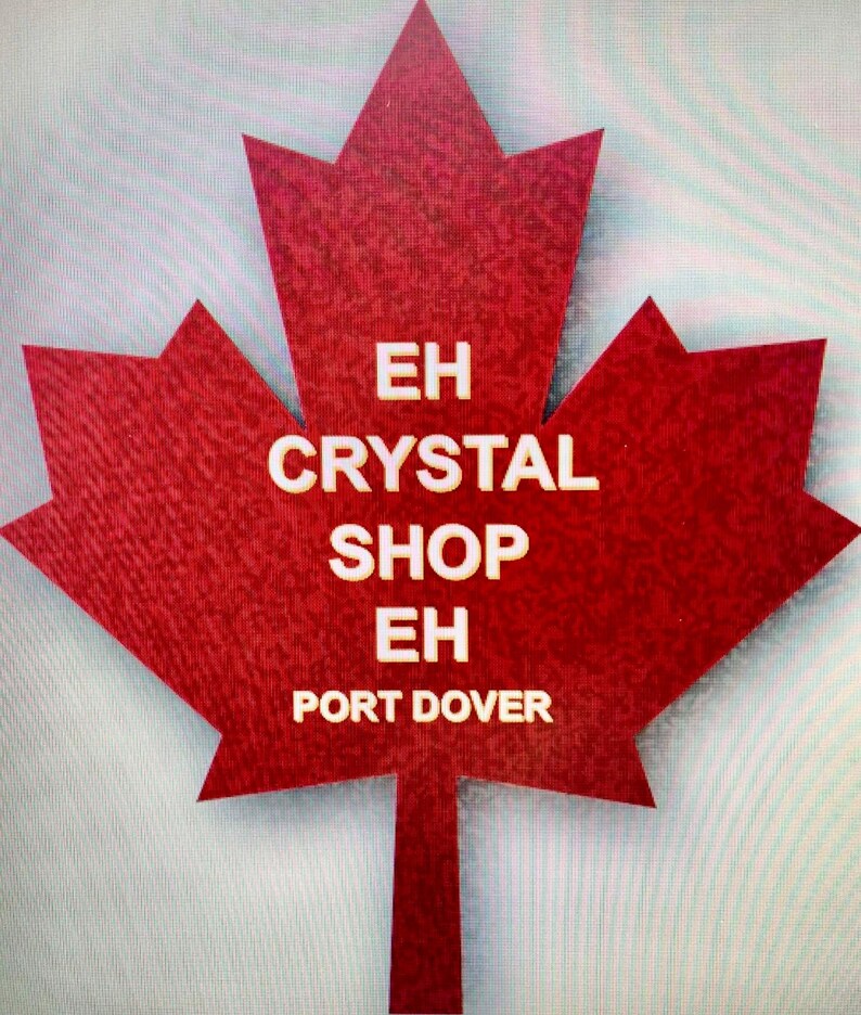 May include: A red maple leaf with the text "EH CRYSTAL SHOP EH PORT DOVER" in white.