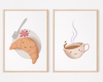 May include: Two framed prints with illustrations of a croissant and a cup of coffee. The croissant has a happy face and is on a plate with a fork and a red stain. The coffee cup has a happy face and steam coming from it.