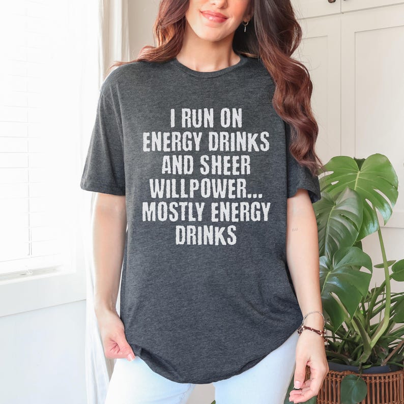 Grey t-shirt featuring text I run on energy drinks and sheer willpower... mostly energy drinks shirt