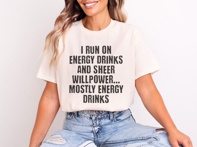 Beige t-shirt featuring text I run on energy drinks and sheer willpower... mostly energy drinks shirt