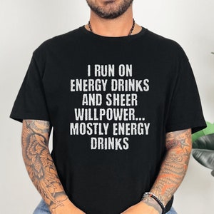 Black t-shirt featuring text I run on energy drinks and sheer willpower... mostly energy drinks shirt