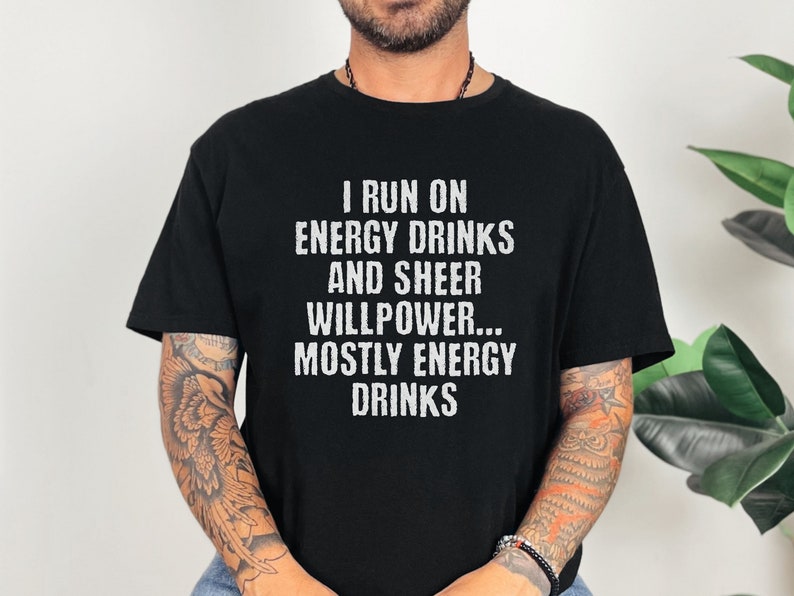 Black t-shirt featuring text I run on energy drinks and sheer willpower... mostly energy drinks shirt