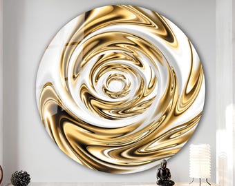 May include: Circular wall art with a swirling gold and white design. The artwork has a glossy finish and an abstract pattern. The gold elements create depth and movement, making it a striking decorative item. The piece is suitable for various interior styles.