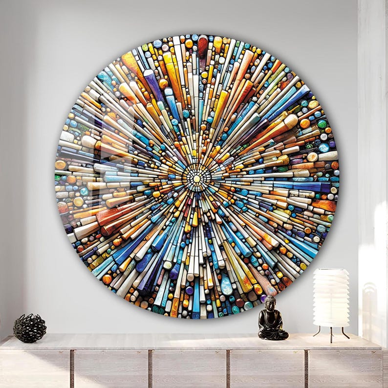 May include: A round wall art piece with a colorful mosaic design. The mosaic is made up of small, colorful pieces of glass and ceramic. The design is a radial pattern, with the colors radiating out from the center. The colors are bright and vibrant, and the overall effect is very eye-catching.