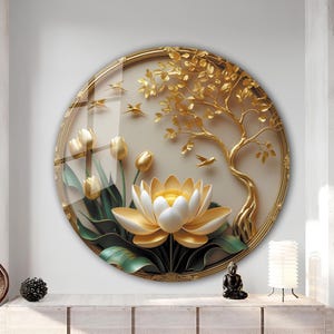 May include: A round, gold-framed wall art piece featuring a 3D relief of a lotus flower, tulips, and a tree. The artwork has gold and white accents, with green leaves and small flying birds. The background is a light beige color.