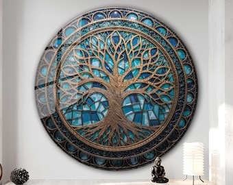 May include: A round wall art piece featuring a tree of life design. The tree is rendered in a bronze color, set against a mosaic of blue and teal glass. The artwork is framed with a dark, ornate border.