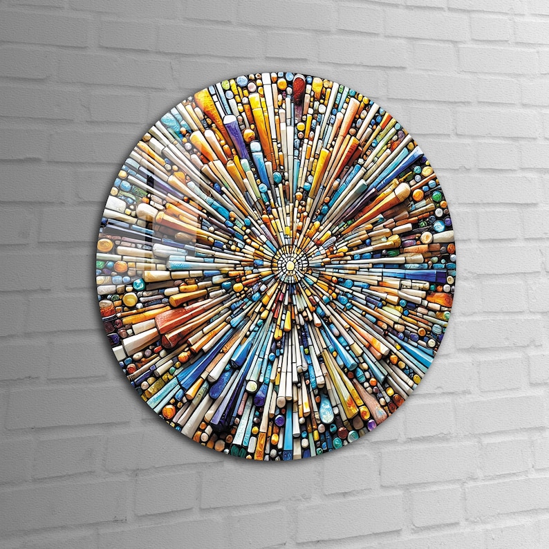 May include: A circular abstract art piece with a mosaic design. The mosaic is made up of small, colorful pieces of glass or tile. The colors in the mosaic include blue, yellow, orange, red, and green. The mosaic is arranged in a radial pattern, with the colors radiating outward from the center.