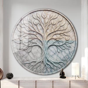 May include: A circular wall art piece featuring a relief sculpture of a tree with intricate branches and roots. The design is set against a marble-textured background, with the upper half in warm beige and the lower half in cool blue tones.