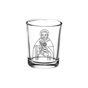 May include: A clear glass shot glass with a black and white line drawing of a man holding a book. The book has the text "SUMMA THEOLOGICA" on the cover.