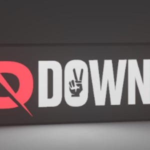 May include: A rectangular graphic in dark grey, featuring the text "Q DOWN 2.0". The "Q" is red with a slash, the word "DOWN" is white, and "2.0" is in a red box. A peace sign is in the word "DOWN".