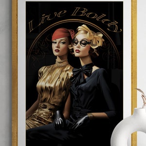The phrase "Live Boldly" is elegantly scripted above them in gold, reinforcing a theme of empowerment and timeless glamour. The dark background accentuates the rich details and bold contrasts of the artwork.
