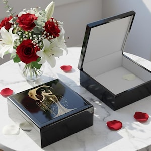 Black Box Construction Art Deco Design Woman Figure Illustration Gold Accent Details Glossy Finish Surface Elegant Jewelry Storage Vintage Style Appearance Decorative Keepsake Container Dresser Top Organizer Vanity Accessory Display Luxury