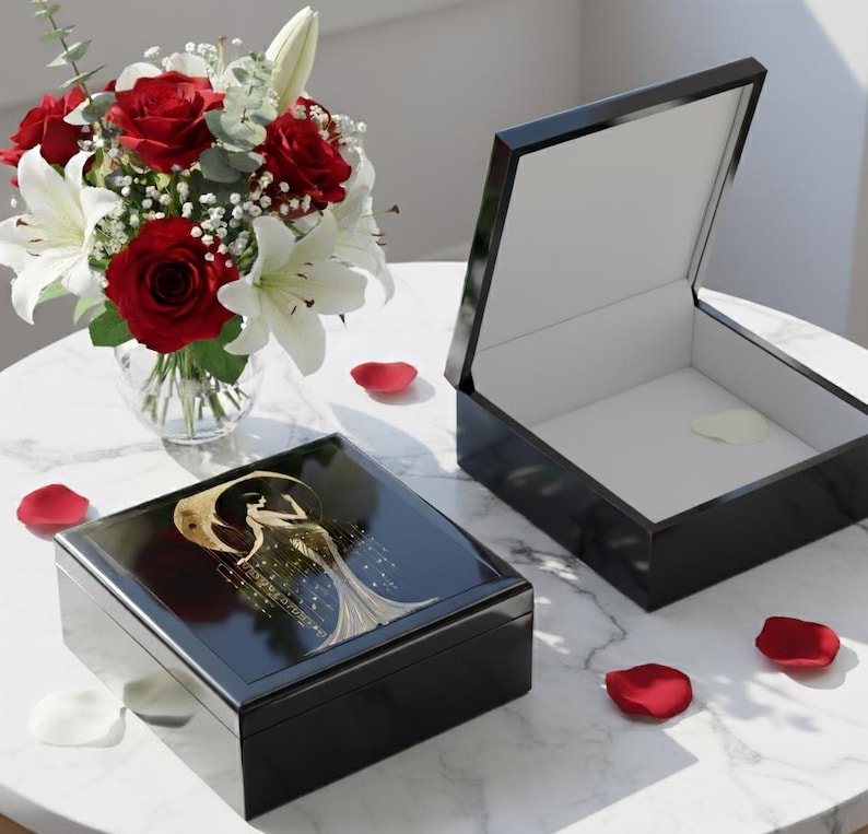 Black Box Construction Art Deco Design Woman Figure Illustration Gold Accent Details Glossy Finish Surface Elegant Jewelry Storage Vintage Style Appearance Decorative Keepsake Container Dresser Top Organizer Vanity Accessory Display Luxury