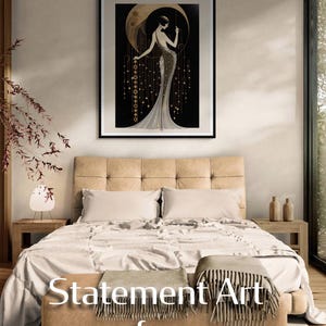 May include: A bedroom scene featuring a framed art print with a woman in an Art Deco style dress. The print hangs above a bed with a beige headboard and neutral-toned bedding. The text "Statement Art for Statement Rooms" is visible.
