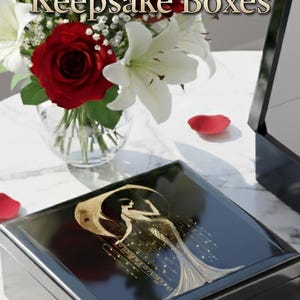 Black lacquer keepsake box with a gold art deco design on the lid. The box is rectangular and sits on a marble surface.