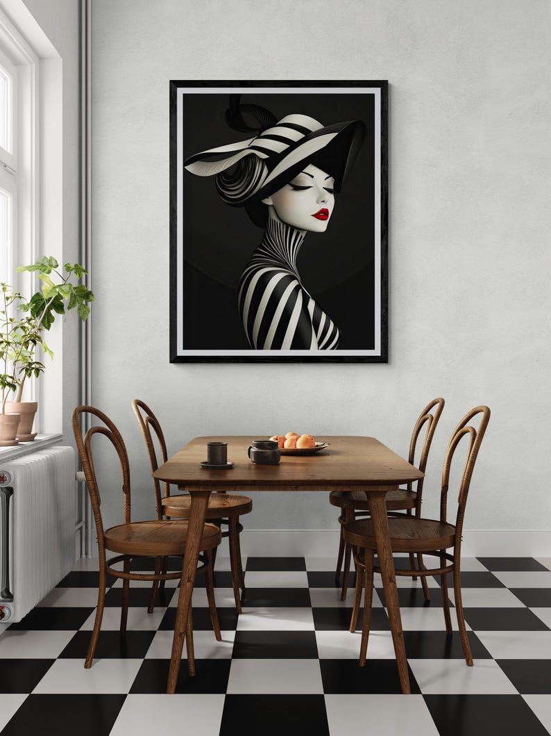 May include: A framed wall art print featuring a stylized portrait of a person wearing a wide-brimmed hat with black and white stripes. The subject has a striped neck and shoulders, closed eyes, and bright red lips against a dark background.