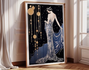 May include: Art Deco style print featuring a woman in a flowing blue and silver gown against a black background with gold accents. The artwork is framed in a gold-colored frame and leans against a white wall.