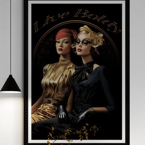 May include: A framed art print featuring two women in vintage attire. One wears a gold dress and red hat, the other a black dress and glasses. The words "Live Bold" are arched above them in gold.