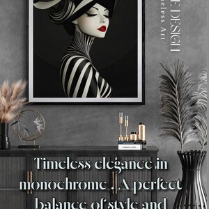 May include: A framed wall art print featuring a stylized illustration of a person wearing a wide-brimmed striped hat and a high-neck striped garment, with bold red lips. The text YARIE DESIGN Timeless Art is visible on the right side of the frame.