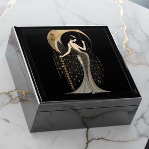 Black Jewelry Box Art Deco Woman Figure Gold Accent Details Vintage Style Design Elegant Storage Solution Decorative Keepsake Container Glossy Finish Construction Stylish Vanity Accessory Dresser Top Organizer Luxury Gift Idea Treasure