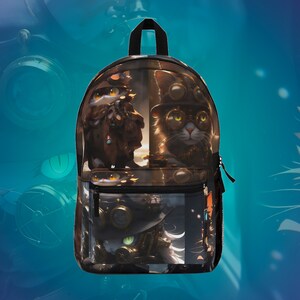 May include: Black backpack with a colorful print of two cats wearing goggles and steampunk-inspired accessories. The cats are on a brown and gold background.