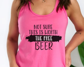 May include: Pink tank top with a black graphic that says "Not sure this is worth the free beer".
