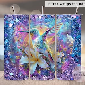 May include: A tumbler with a vibrant design featuring a hummingbird with colorful wings, perched on white flowers. The background has a glittery, abstract design with the text "6 free wraps included". The tumbler has a silver straw.