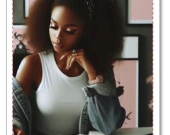 May include: A woman with dark curly hair is sitting at a desk, reading a notebook. The notebook is open and has a blank page. The woman is wearing a white tank top and a denim jacket. The text "Truth Be Told Oracles by Empress Domm" is visible on the notebook.