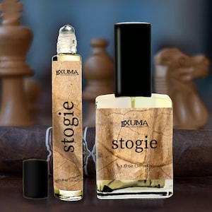 May include: Two perfume bottles with the word "stogie" printed on them. One is a roll-on bottle, and the other is a spray bottle. The bottles have a tobacco leaf design and the text "EXUMA FRAGRANCE CO". The roll-on bottle is 0.33 fl oz (10 ml), and the spray bottle is 1 fl oz (30 ml).