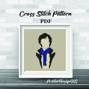 May include: Cross stitch pattern PDF of a person with black hair wearing a blue scarf and a black jacket. The pattern is in a white frame on a brick wall background.