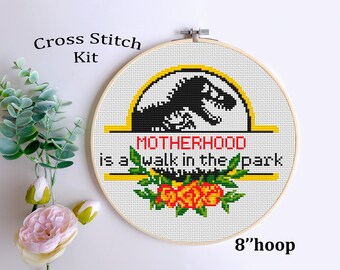 May include: Cross stitch kit featuring a dinosaur with the text "MOTHERHOOD is a walk in the park" and red flowers. The kit is for an 8-inch hoop.