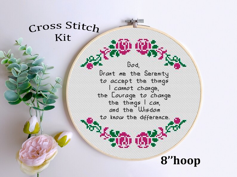 May include: Cross stitch kit featuring a quote about serenity, courage, and wisdom. The quote is surrounded by pink roses and green leaves. The kit includes an 8-inch hoop.