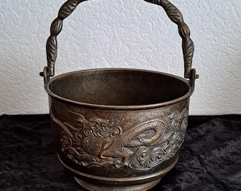 Bronze cauldron with Chinese dragons and elaborate handles