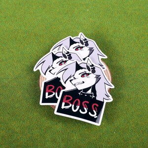 May include: Three stickers featuring a black and white illustration of a wolf-like character with red eyes and the text "Boss" in red and black lettering.