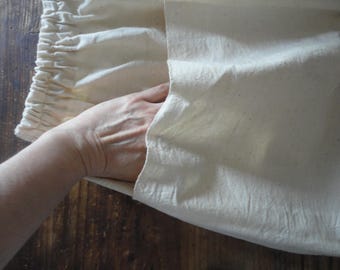 Gonna midi in cotone grezzo tessuta a mano, elastico in vita, tasche