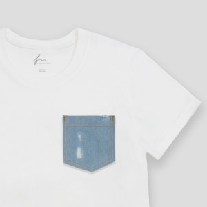 May include: White short-sleeved t-shirt with a blue denim pocket. The pocket has distressed details.