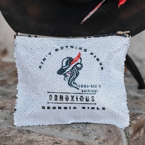 Georgia Bulldogs Sequined Pouch with Emma-Ree’s Obnoxious Georgia Girl logo- sequins flip to all black for a night out on the town.