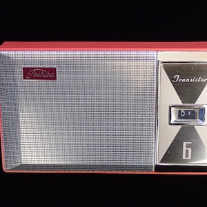 Vintage Toshiba Transistor Radio with case and earbud.