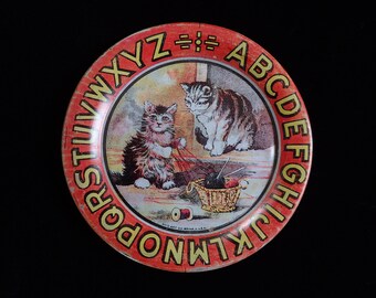 Antique ABC tin plate with kittens playing with yarn.