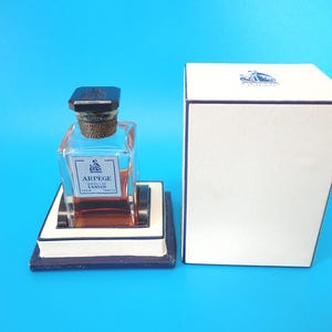 Vintage Lanvin Arpege 1/2 ounce Perfume Bottle. 1/3 full, with original box.
