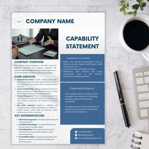 May include: A professional real estate capability statement with the company name at the top. The document includes sections for company overview, core services, key differentiators, and contact information. A cup of coffee, a keyboard, and a pen are also visible.