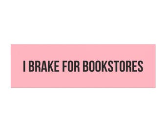 May include: A rectangular pink sticker with the phrase "I BRAKE FOR BOOKSTORES" in bold black letters. The sticker is designed to be eye-catching and is suitable for book lovers.