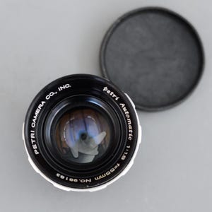 May include: A rustic wooden sign with the text "Welcome to our home" in white lettering. The sign has a distressed finish and a simple, inviting design, ideal for entryway decor.