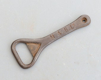 Vintage M. & B. Ltd Cast Iron Collectable Bottle Opener