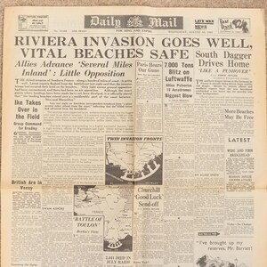 May include: A historical Daily Mail newspaper from August 16, 1944, reporting on the Riviera invasion. The front page includes headlines such as "Riviera Invasion Goes Well" and "Allies Advance." The paper also features a map of the invasion fronts.