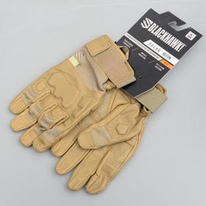 May include: Tan tactical gloves with reinforced padding and the text "BLACKHAWK! S.O.L.A.G. RECON" on the attached product tag. Features include touch screen compatibility, knuckle protection, and cut & flame resistant.