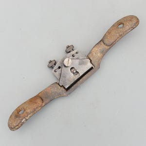 May include: A rustic wooden sign with the text "Welcome to our home" in white lettering. The sign features a distressed finish and a simple, inviting design, perfect for front door decor.