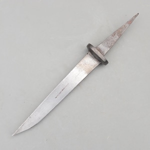 May include: A vintage, antique metal dagger with a pointed blade and a circular guard. The blade is silver with some rust and the text "WILSON BROTHAL" is visible. The dagger is set against a gray background.